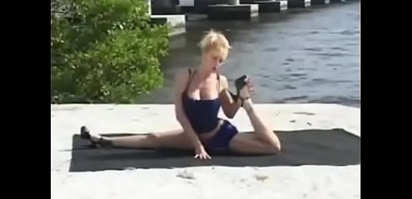  Big tits Desiree Starr bending her body on the beach
